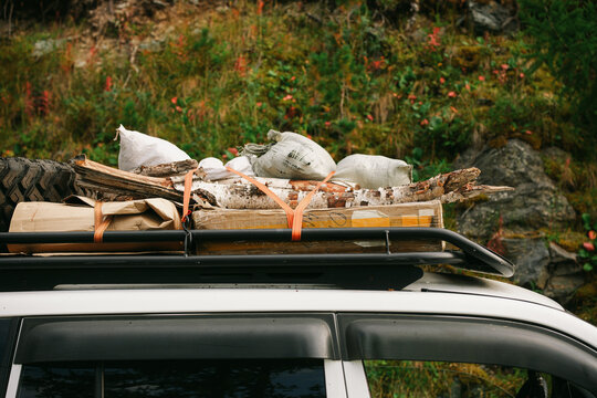 Expedition car roof rack loaded with camping gear and equipment for road trip