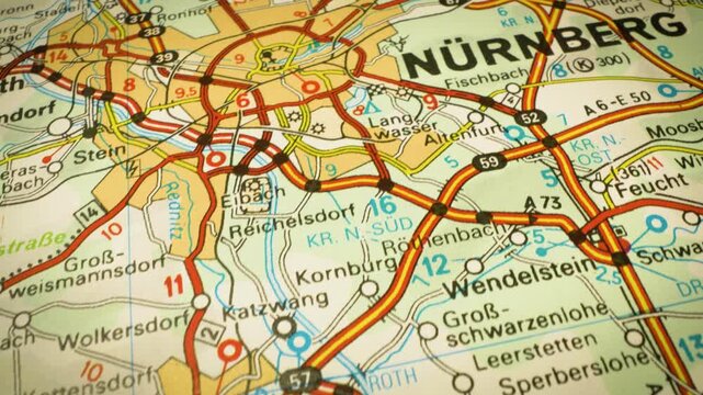 nuremberg, germany &ndash; road network leading to the city, gliding view over atlas map