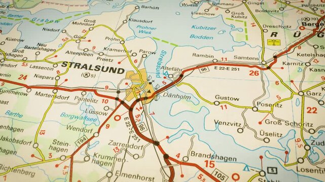 detailed road map to stralsund, germany &ndash; gliding camera view over atlas map