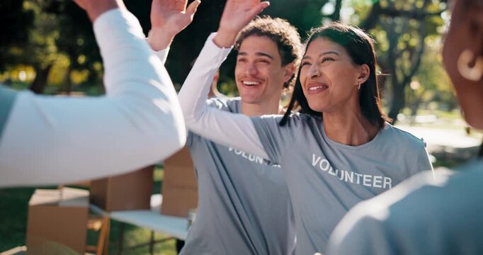 Charity, volunteer and high five with friends, outdoor or team with clipboard for donation schedule. Nonprofit, community service and happy people with checklist, laughing and celebration for success