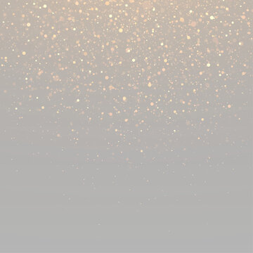Festive glitter background with sparkling particles and luminous bokeh.