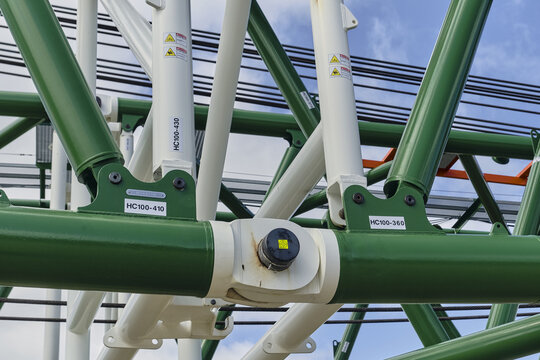 Thisted, Denmark - 11 August 2026: View of the structural steel framework of the BMS Heavy Cranes 3000 ton ring crane, featuring green and white metal beams at the Osterild test center.