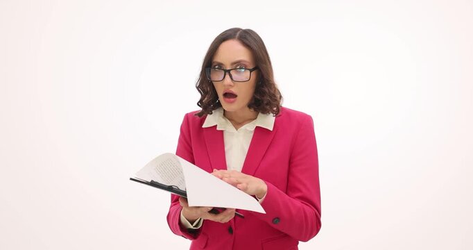 Shocked businesswoman discovers serious mistake in document. Female in glasses covers mouth with hand showing obvious disbelief on white background