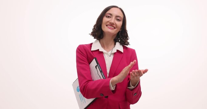 Delighted female corporate executive happily claps hands. Company director expresses sincere happiness about positive achievements on white background