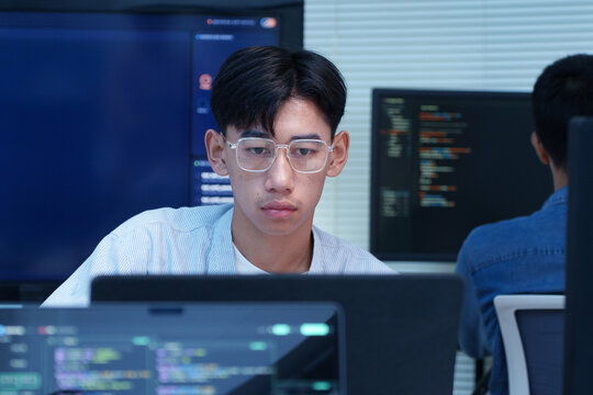 Young Programmer Coding on a Computer
