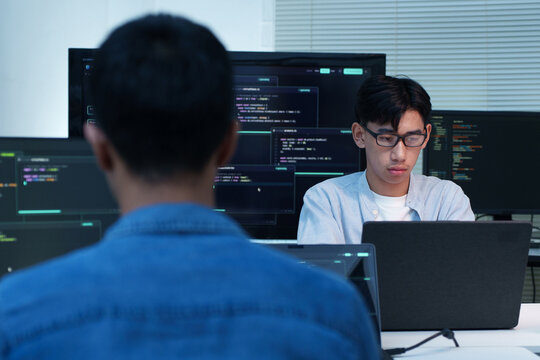 Programmers Collaborating on Software Development and AI Code