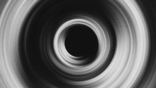 Abstract black and white circular vortex background. Hypnotic monochrome spiral texture with motion blur effect