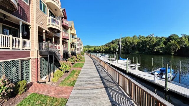 Forward walk explores riverside homes and surrounding scenery in Occoquan Virginia during daytime.
