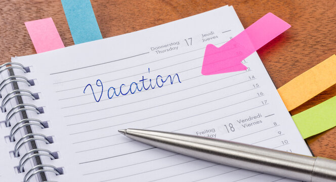 Vacation written on a page in a planner