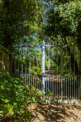 A weathered metal gate stands closed © wundermann