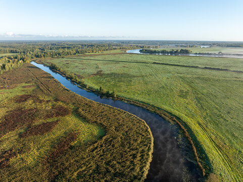 Aerial view of Svete River flowing into Lielupe River in Latvia