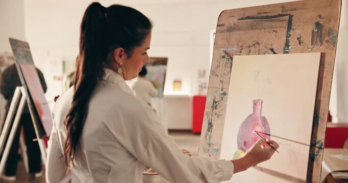 Artist, woman and painting on canvas in class to practice skill, drawing and creative process. Painter, art and person with brush stroke for artistic pot, artwork inspiration or talent in studio