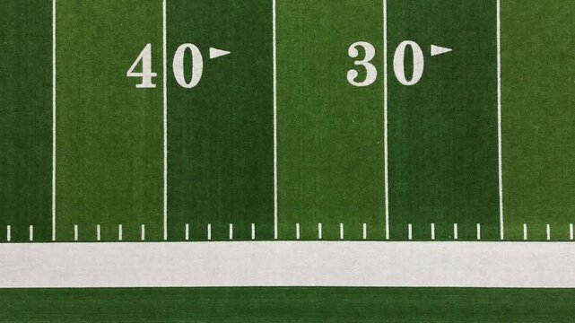 American football field bird's-eye flyover showing yard lines and hash marks