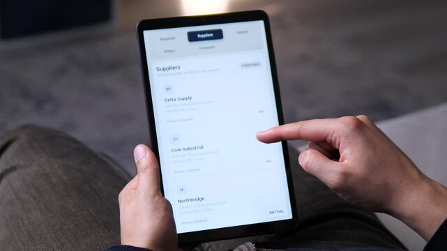 Business user reviews supplier offers and delivery reliability on a tablet, highlighting digital procurement, vendor comparison and smarter supply chain decisions.