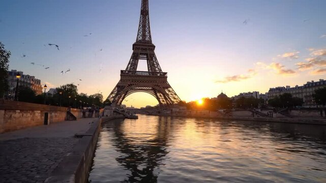 Eiffel Tower and reflections on Seine River at dawn in Paris