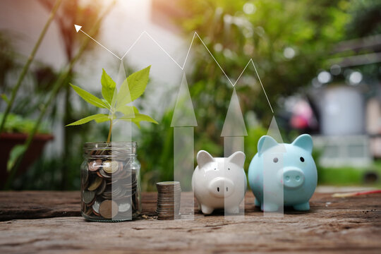 Hand Putting Coin into Piggy Bank with Financial Growth Graph Overlay