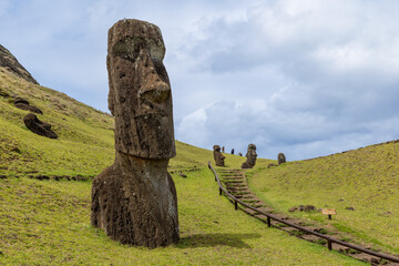 Moai Tukuturi at Rano Rarakuon easter island. Beautiful Moai Statues with beautiful blue sky in the background and green gras in the foreground  © Sven Taubert