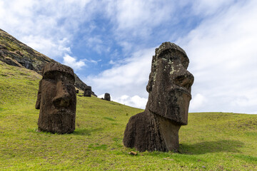 Moai Tukuturi at Rano Rarakuon easter island. Beautiful Moai Statues with beautiful blue sky in the background and green gras in the foreground  © Sven Taubert