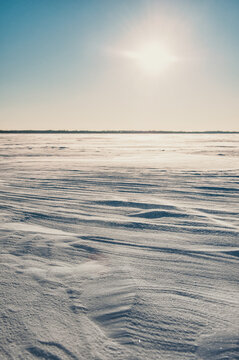 Frozen sea covered with wind shaped snow