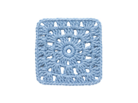 Light blue crocheted granny square isolated on black, featuring handmade yarn textile with traditional stitch pattern for cozy vintage charm and hobby craft blog design.