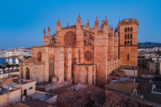 Cathedral in Palma de Mallorca at dusk with surrounding city