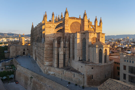 Cathedral in Palma de Mallorca with surrounding cityscape at sunset