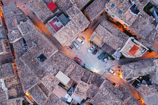 Aerial view of Valdemossa village rooftops with string lights