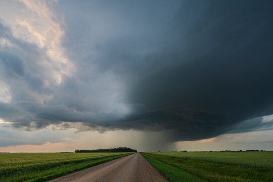 Storm supercell with low precipitation clouds over farmland