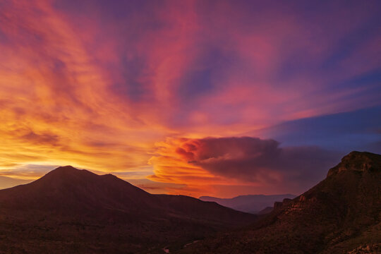 Thunderstorm at Sunset over globe mountains