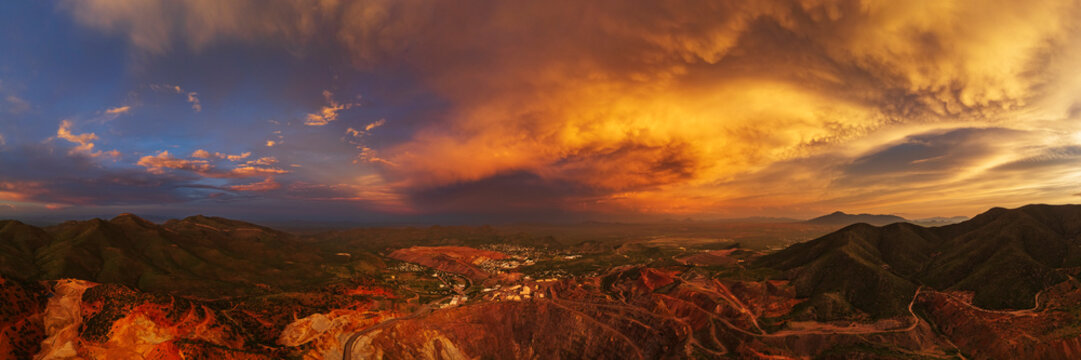 Aerial view of the Bisbee Copper Mine at Dusk with storm clouds