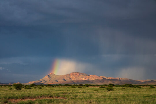 Rain Shafts and Rainbow over Arizona mountains