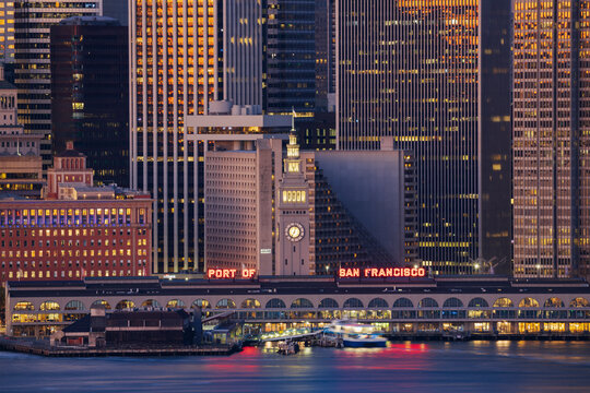 Port of San Francisco ferry building with city skyline at dusk