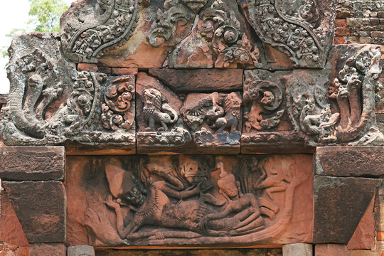 Close-up of the authentic sandstone carving details of the Narayana Phantomsin lintel at Peuai Noi Sanctuary, Khon Kaen, Thailand
