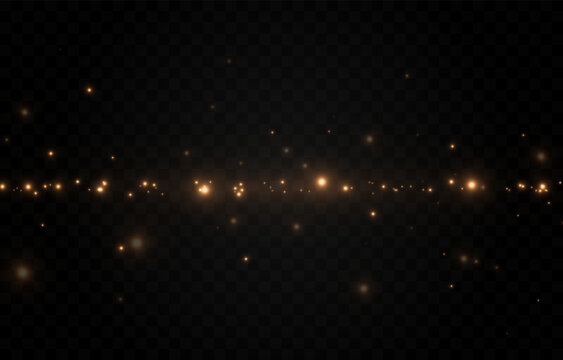 Golden glowing magic dust on a transparent background. Flying light particles PNG. Glowing dust PNG.