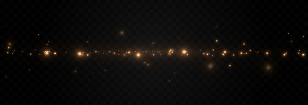 Golden glowing magic dust on a transparent background. Flying light particles PNG. Glowing dust PNG.