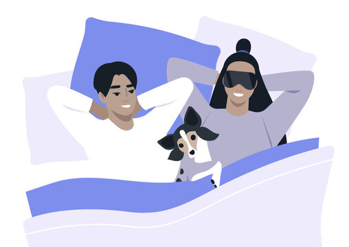 A family of two shares a joyful morning in bed, surrounded by soft pillows and blankets, bonding with their dog who is peacefully nestled among them, capturing moments of love and warmth.
