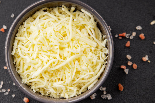 Grated cheese shredded mozzarella serving size ingredients healthy eating  snack fresh gourmet rustic food background on the table top view copy space