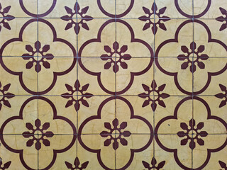 Vintage patterned floral ceramic floor tiles top view. Classic Javanese tegel motif architectural interior surface backdrop mockup for design. © Setyotuhu