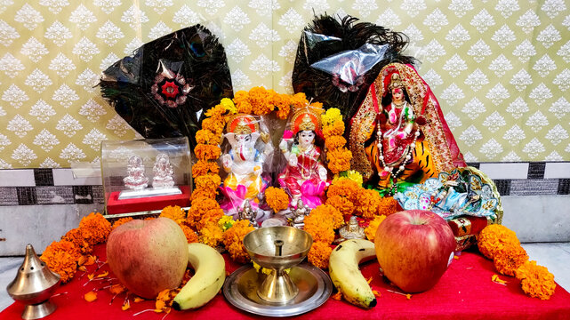 Traditional Hindu Diwali Puja Altar Setup with Idols and Offerings