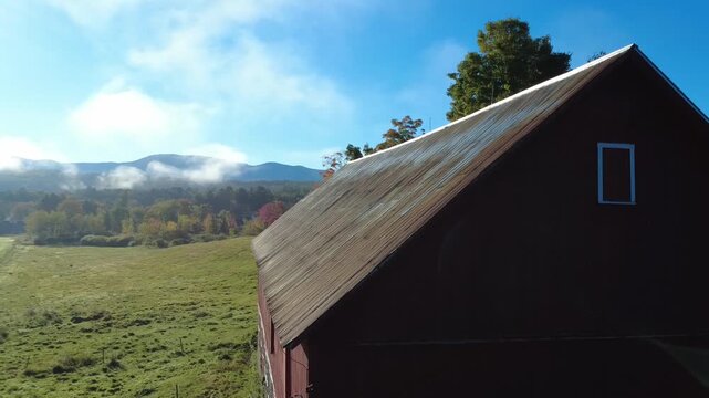 red barn in the mountains