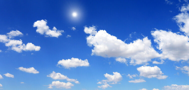 blue sky with clouds and sun shines	
