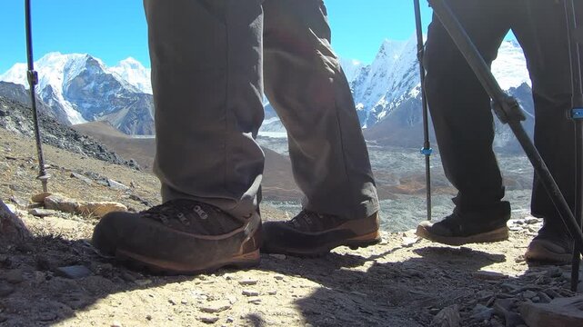Group of climbers at the summit of Chhukung Ri, enjoying panoramic views of the Himalayan peaks, including Lhotse, Nuptse, Pema Dablam, Thamserku, and other surrounding mountains in the Nepal