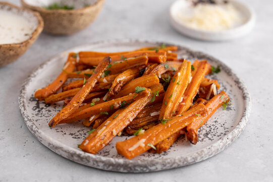 Close-up roasted carrots with parmesan, healthy side dish