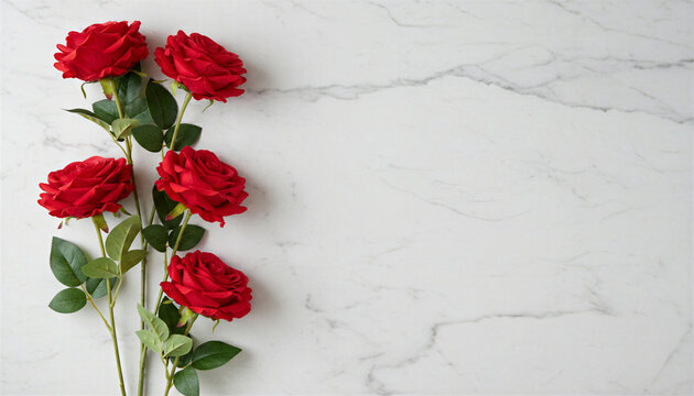 Red roses on white marble surface