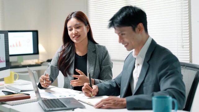 Business Team Discussing Financial Strategy in Office