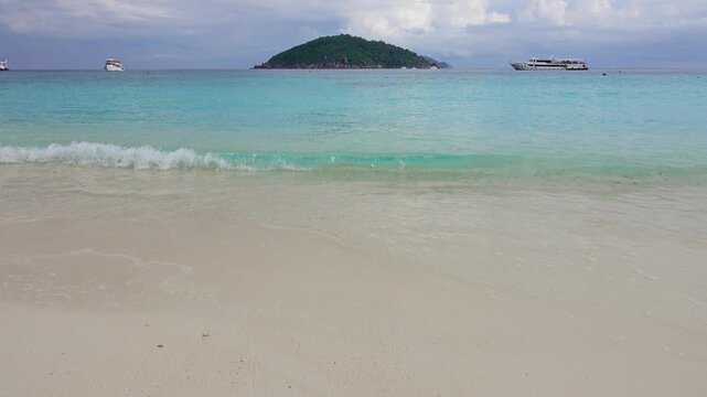 View of Similan Islands with turquoise waters and white sand beaches in Lam Kaen, Phang Nga, Thailand.