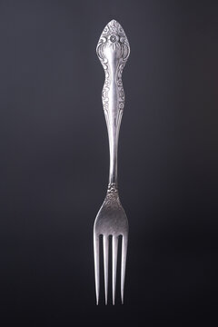 Silver fork close up  on a black background