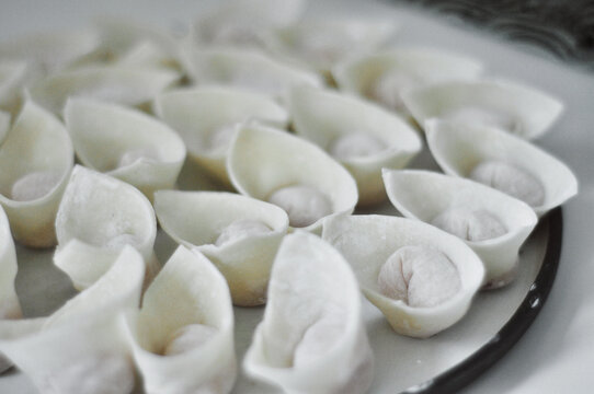 Closeup of freshly made, homemade wontons on a plate