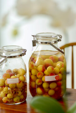 Closeup of homemade apricot liqueur in a glass jar