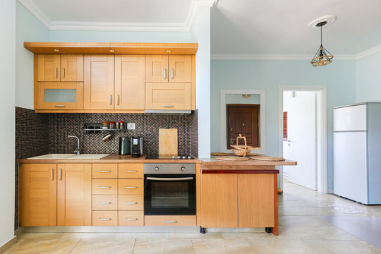 Kitchen Bright Setting With Wood Cabinets and Appliances
